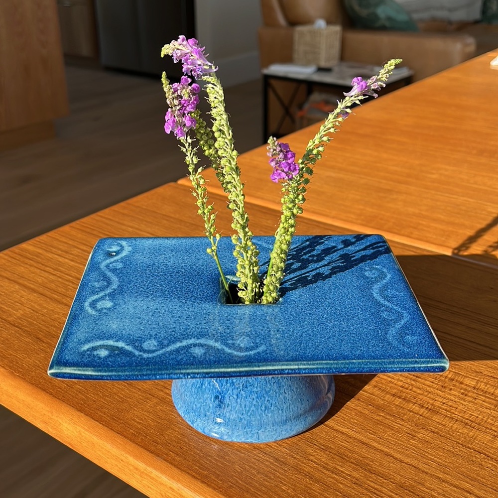 Charming modern cobalt blue flower pottery vase with built-in flower frog.